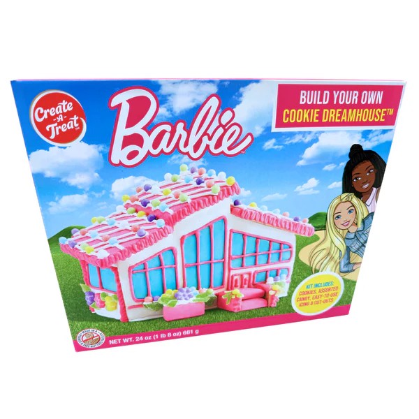 A colorful Barbie Cookie Dreamhouse Kit box displayed beside an assembled pink decorated cookie house.